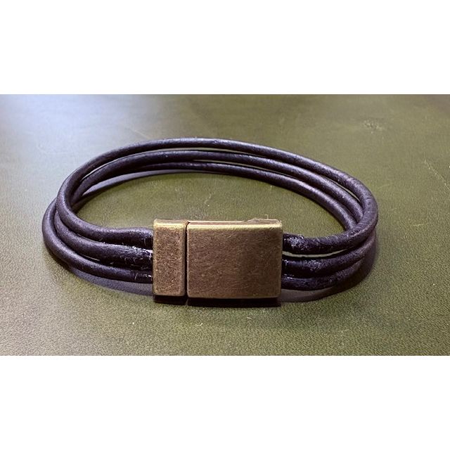 Black three strand  leather bracelet with a bronze clasp surface