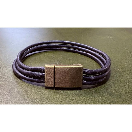 Black three strand  leather bracelet with a bronze clasp surface