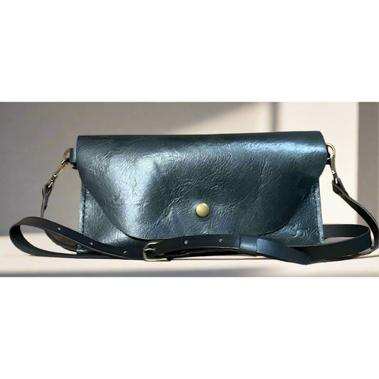 Black leather handbag with a gold button