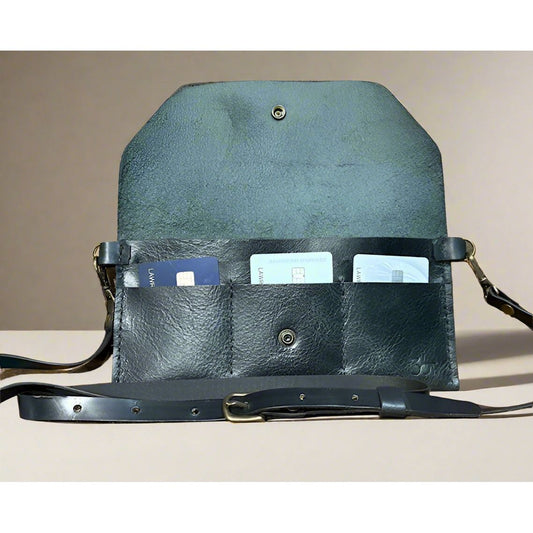 Black leather bag with snap closure